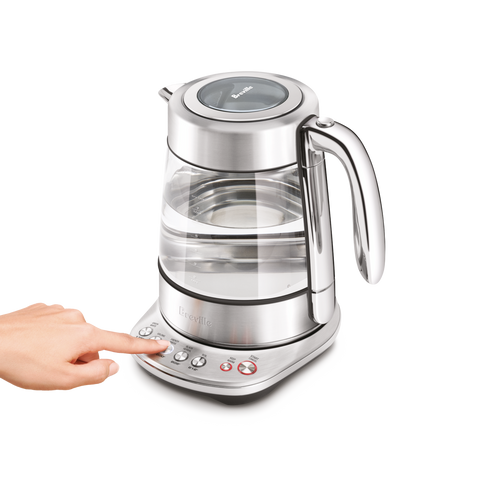 Glass electric kettle with digital display and control panel on a white background