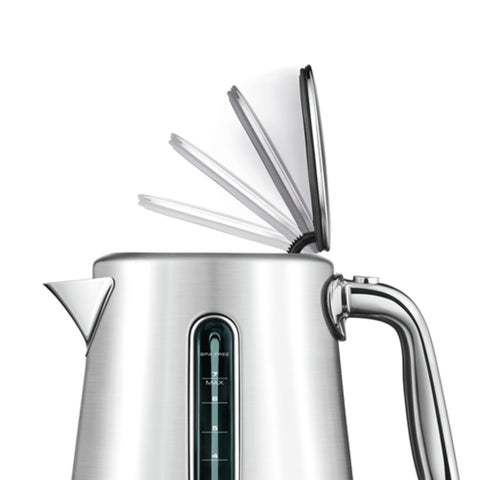 Silver electric kettle with a transparent lid on a white background