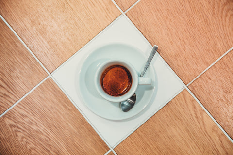 a cup filled with an espresso shot