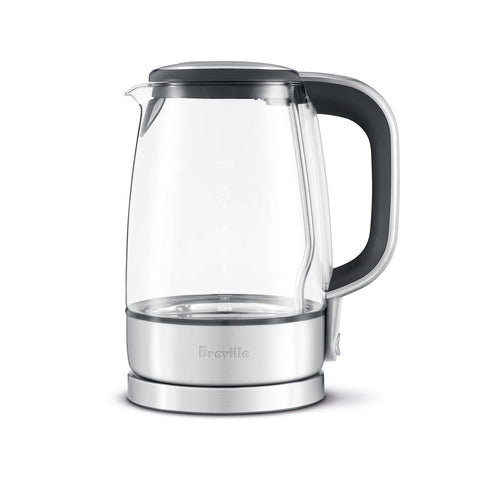 Clear glass electric kettle with black lid and handle on a white background
