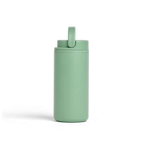 Green tumbler with a straw lid on a white background