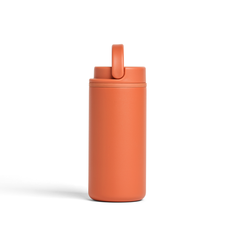 Orange tumbler with a straw lid on a white background
