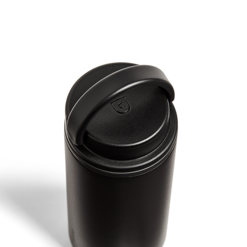 Black travel mug with a lid on a white background