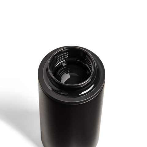 Black cylindrical object on a white background