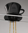Kalita Plastic Black coffee filter on a gray background
