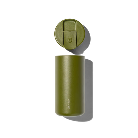 Green thermos with lid on a white background