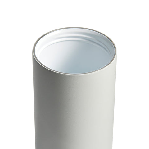 Cylindrical ceramic tumblr with a light blue interior on a white background
