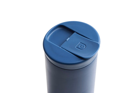 Blue tumbler with a blue lid on a white background