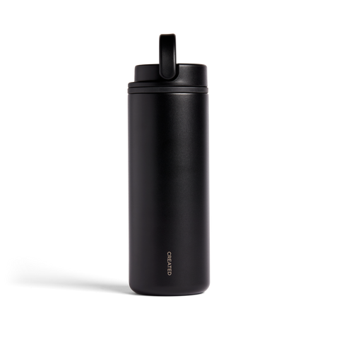 Black insulated bottle with a straw lid on a white background