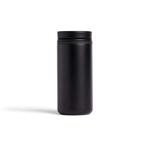 Black cylindrical tumblr with lid on a white background