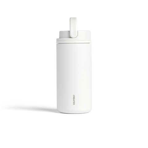 White water bottle with straw on a white background