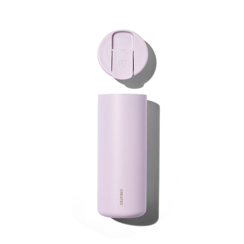 Purple water bottle with cap on a white background