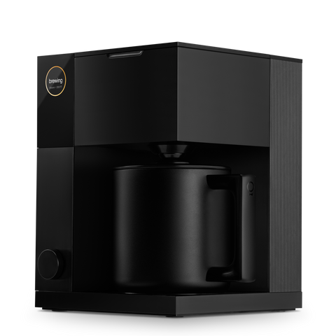 Fellow Aiden  Black coffee machine with a mug on a white background