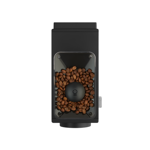Black coffee grinder with coffee beans on a white background