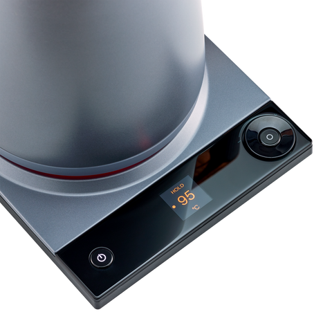 Modern kitchen stove with digital display on a white background