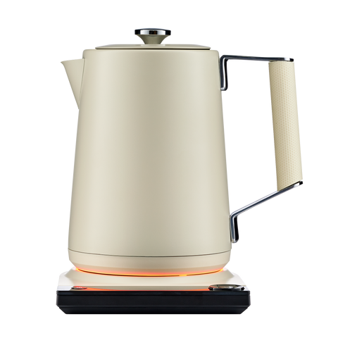 Beige electric kettle with a glowing base on a white background