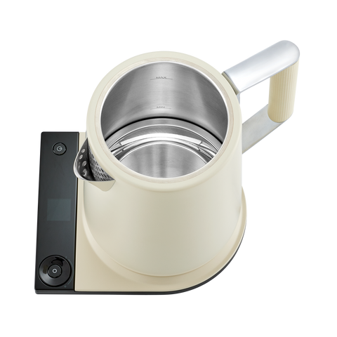 White electric kettle with digital display on a white background