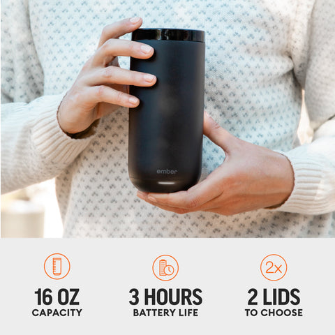 Person holding a black Ember mug with product features displayed below.