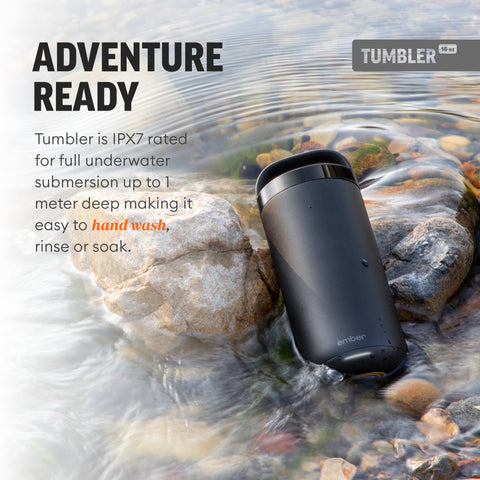 Black tumbler in water with text about its IPX7 rating and features.
