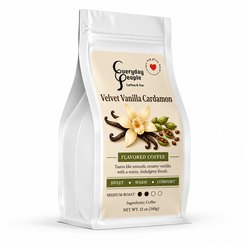 A 12 oz bag of Everyday People Velvet Vanilla Cardamoon flavored coffee, featuring a white stand-up pouch with a beige label decorated with vanilla flower and bean illustrations.