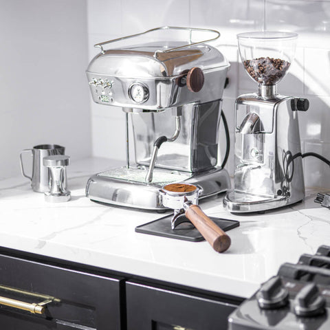 Ascaso Dream PID Automatic Home Espresso Machine - Aluminum  and grinder on a white countertop