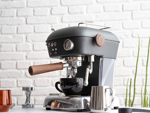 Ascaso Dream PID Automatic Home Espresso Machine - Anthracite on a white countertop with a white brick wall background