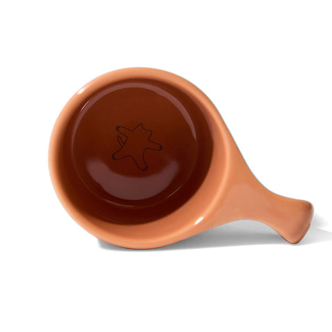 Ceramic bowl with handle on a white background