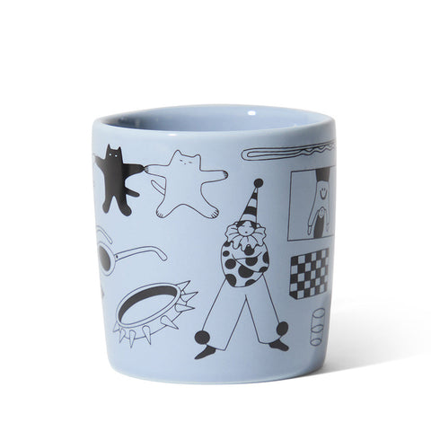 Light blue mug with black and white illustrations on a white background