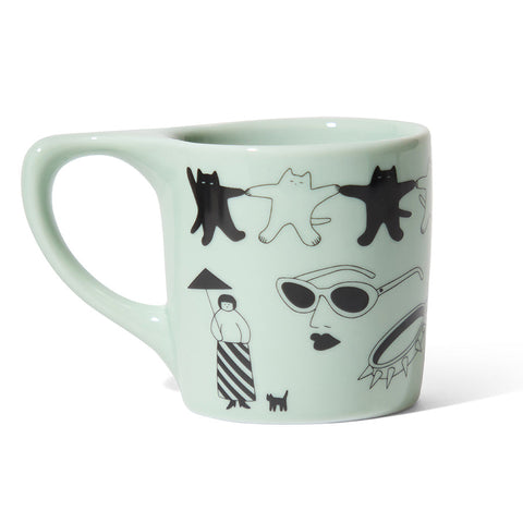 Mint green mug with black and white illustrations on a white background