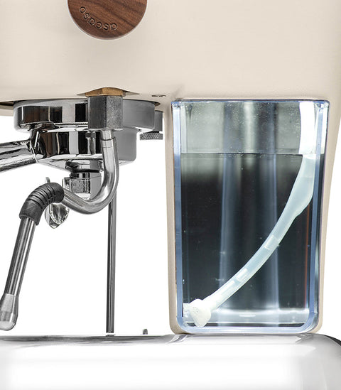 Ascaso Dream PID Automatic Home Espresso Machine - Sweet Cream close up with water reservoir and brewing mechanism.