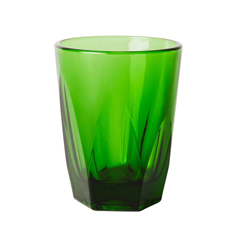 Green glass tumbler on a white background