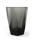 Black glass tumbler on a white background